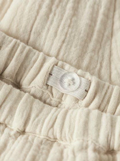 Name it BABY | Safi unisex musselin bukse - Almond Milk